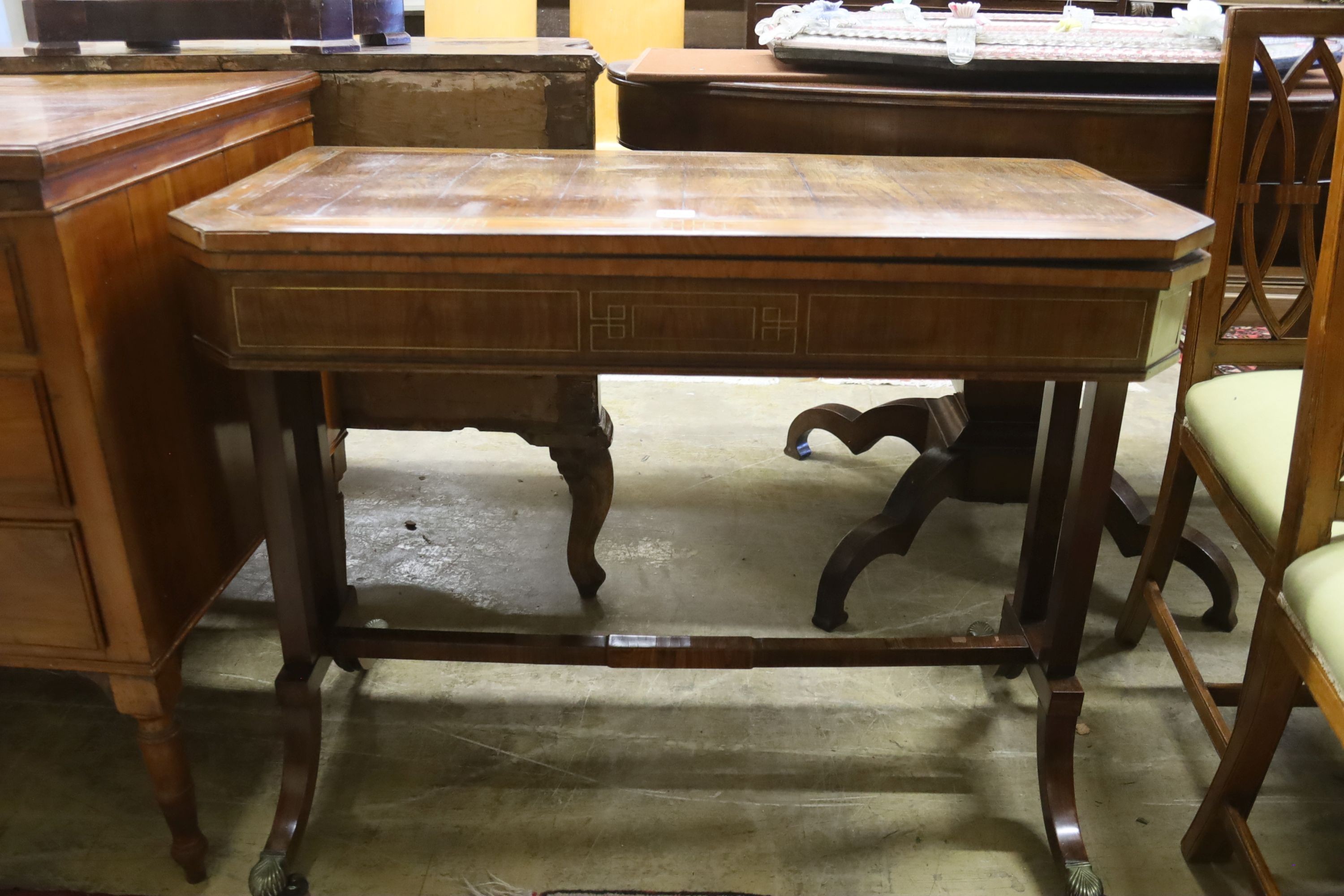 A Regency Kingwood folding card table, banded and brass line inlaid, width 89cm, depth 44cm, height 71cm